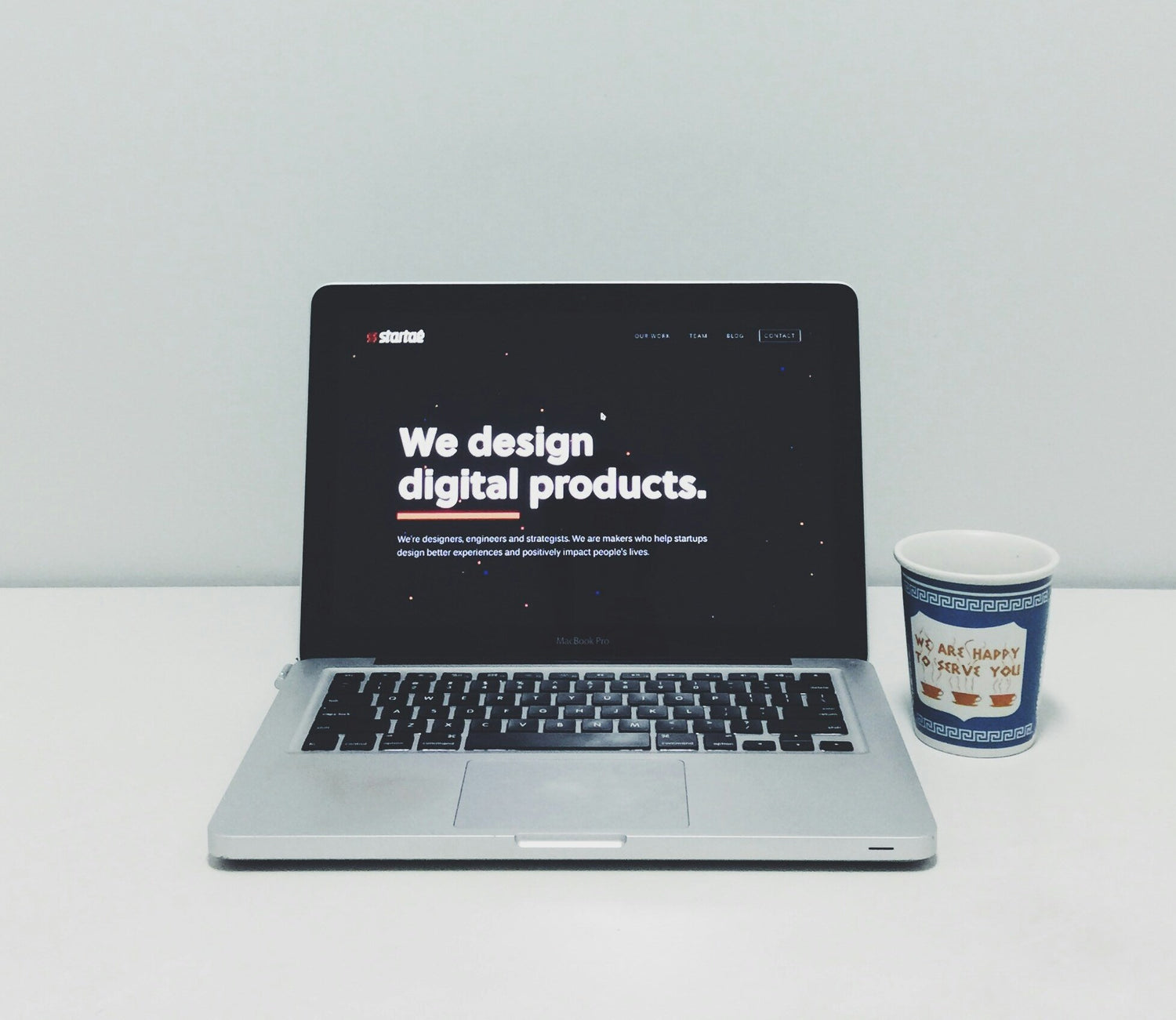an image of a mackbook showing we design digital products in resell nest plr store